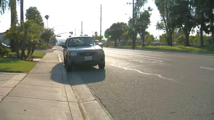 The couple's SUV was left parked on the street in Simi Valley with a shattered window on July 3, 2025. (KTLA)