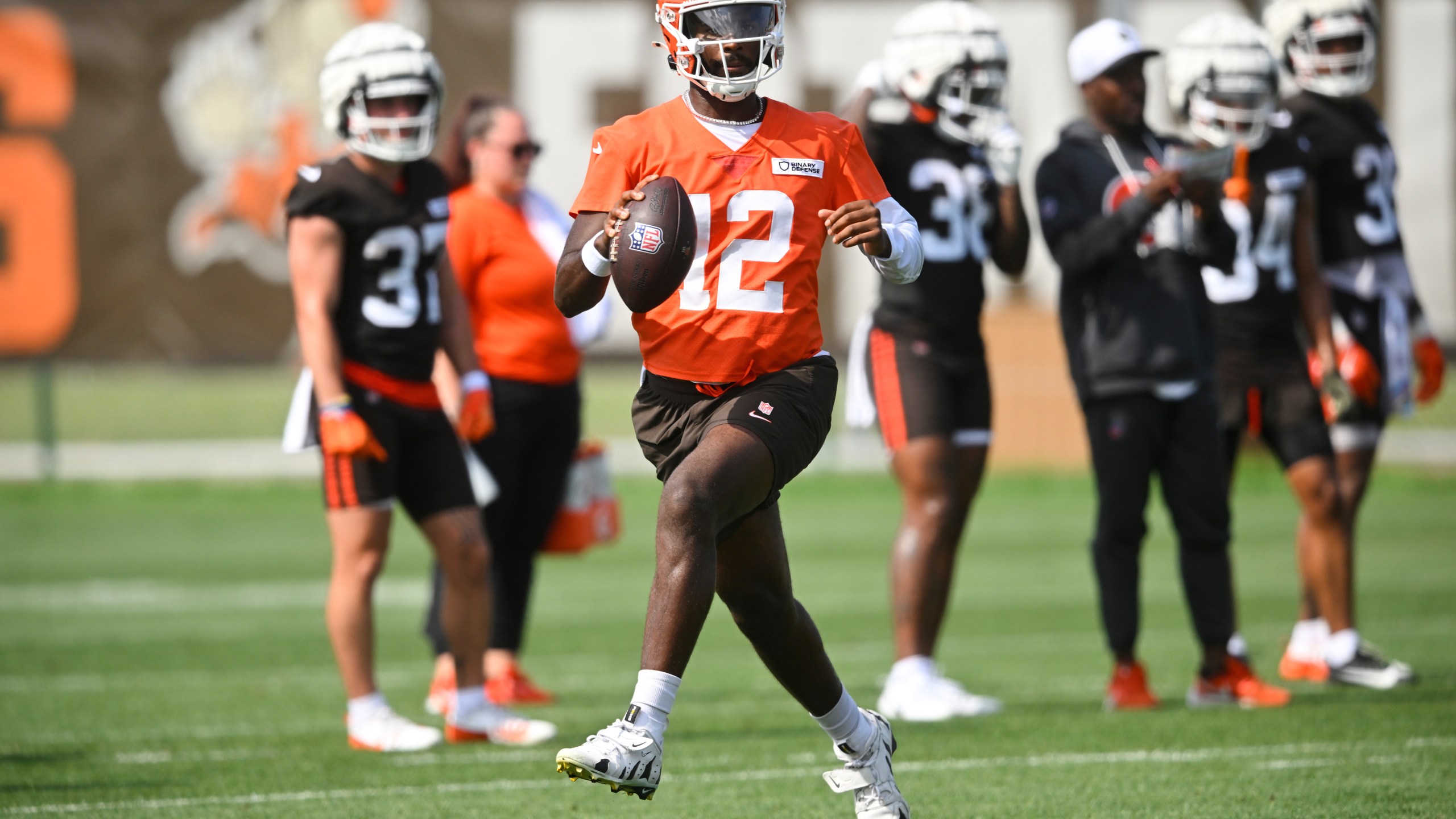 FILE - Cleveland Browns quarterback Shedeur Sanders (12) scrambles during practice at the team's NFL football training camp, Saturday, July 26, 2025, in Berea, Ohio. (AP Photo/David Richard, File)