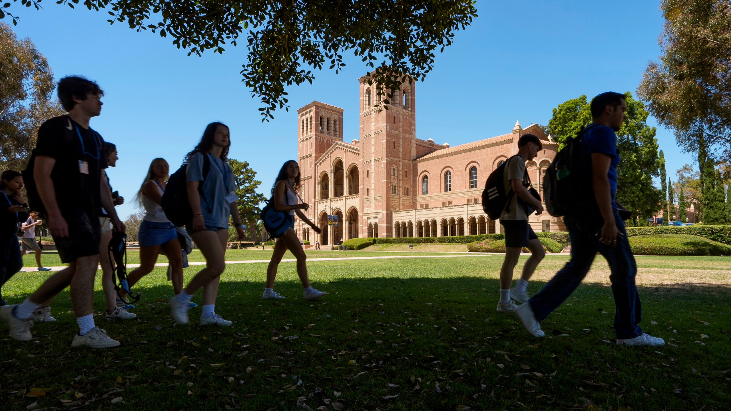 FILE - Students walk past Royce Hall at the University of California, Los Angeles, campus in Los Angeles, Aug. 15, 2024. (AP Photo/Damian Dovarganes, File)