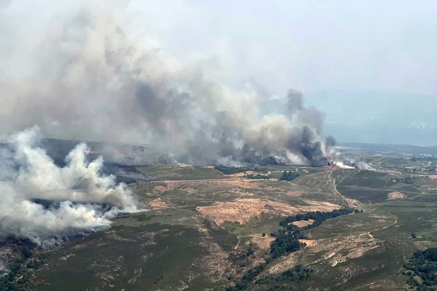 This recent photo taken from a French Canadair water bomber and provided Friday, Aug. 15, 2025 by the Securite Civile shows wildfire in Spain. (Securite Civile via AP)
