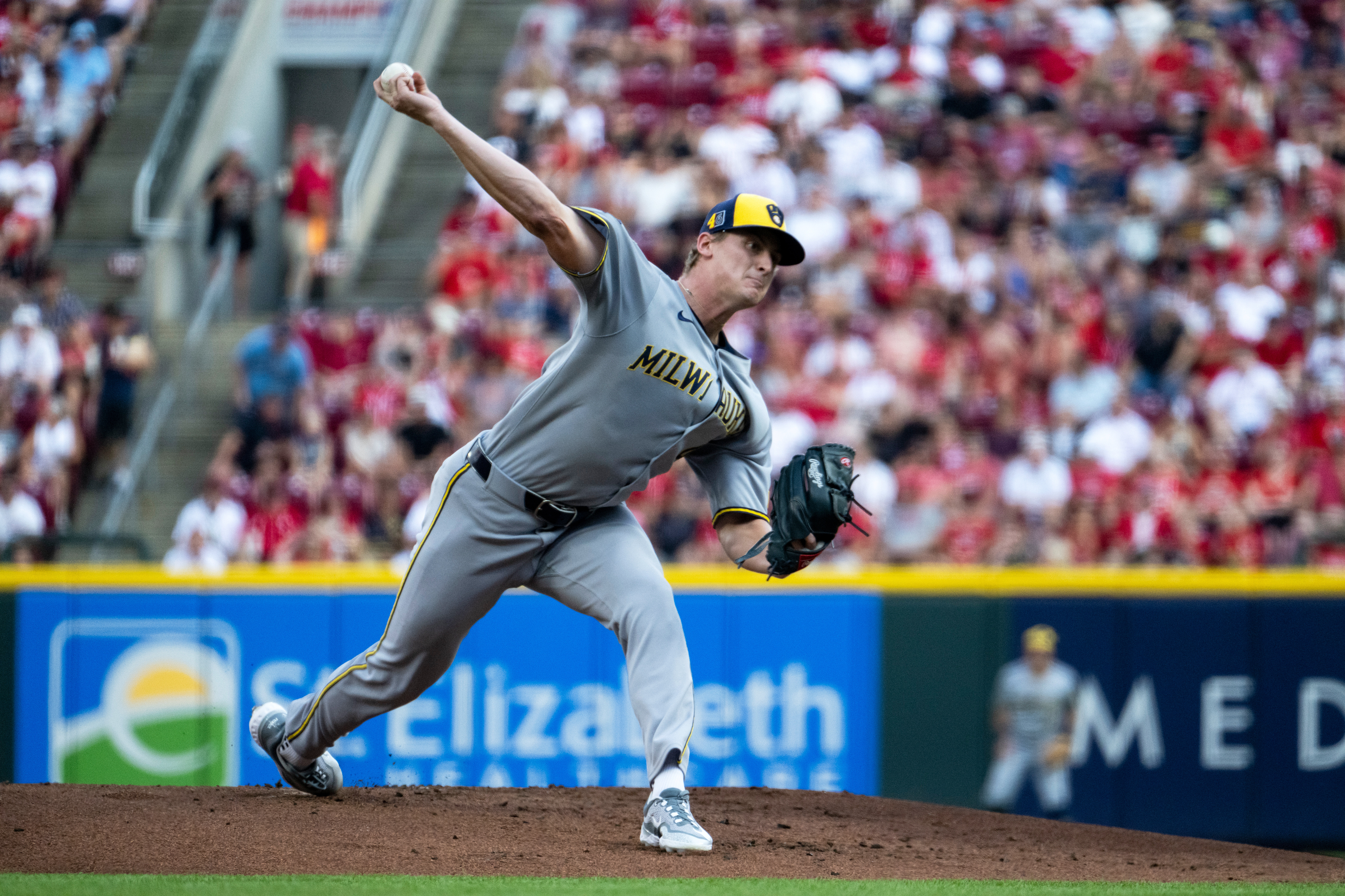 Milwaukee Brewers pitcher Quinn Priester delivers a pitch in the first inning of a baseball game against the Cincinnati Reds, Saturday, Aug. 16, 2025, in Cincinnati. (AP Photo/Michael Swensen)