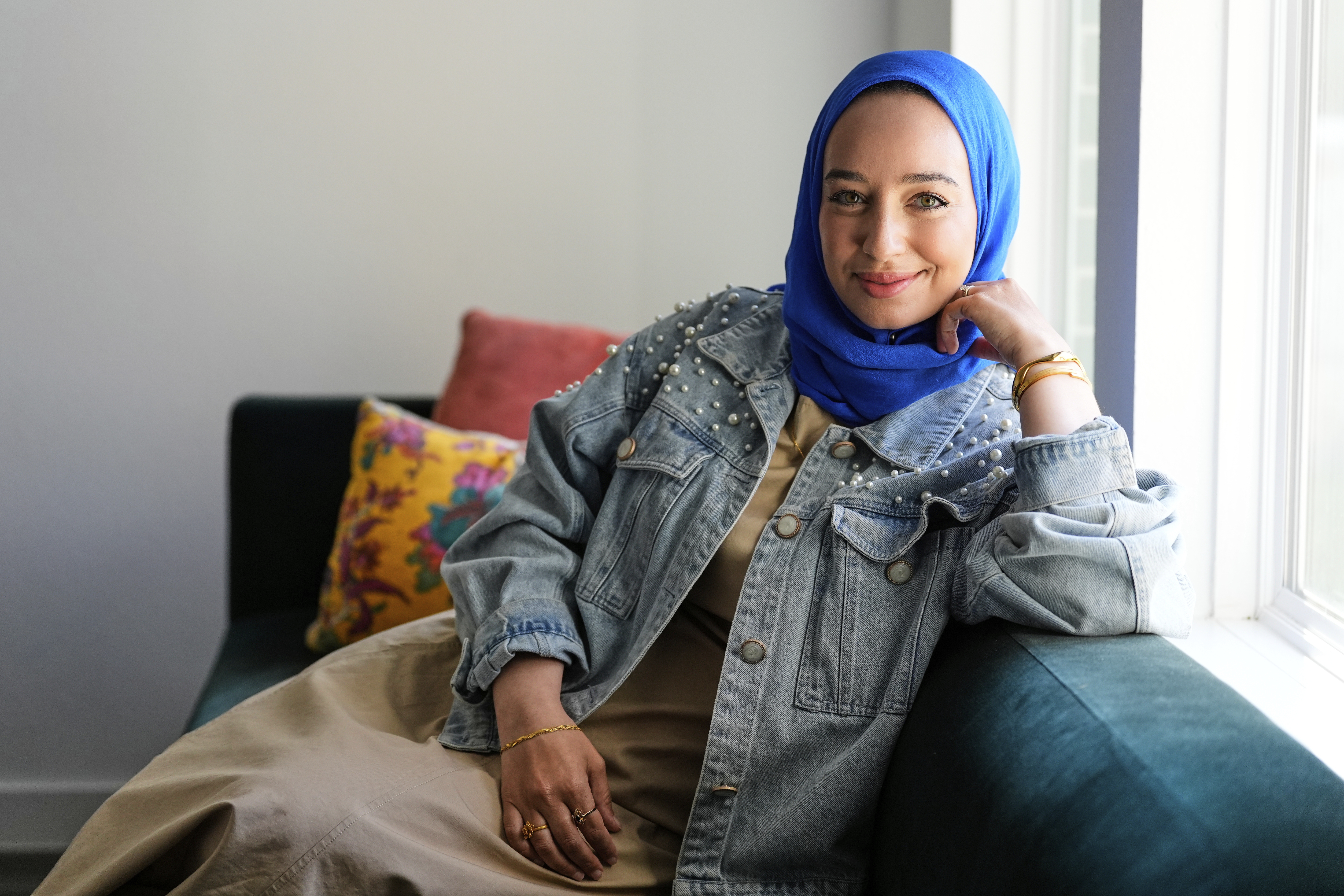 Hoda Abrahim, founder and CEO of Love, Inshallah, a matchmaker featured on the series "Muslim Matchmaker," on Hulu, appears in her home on Monday, Aug. 11, 2025, in Conroe, Texas. (AP Photo/Ashley Landis)