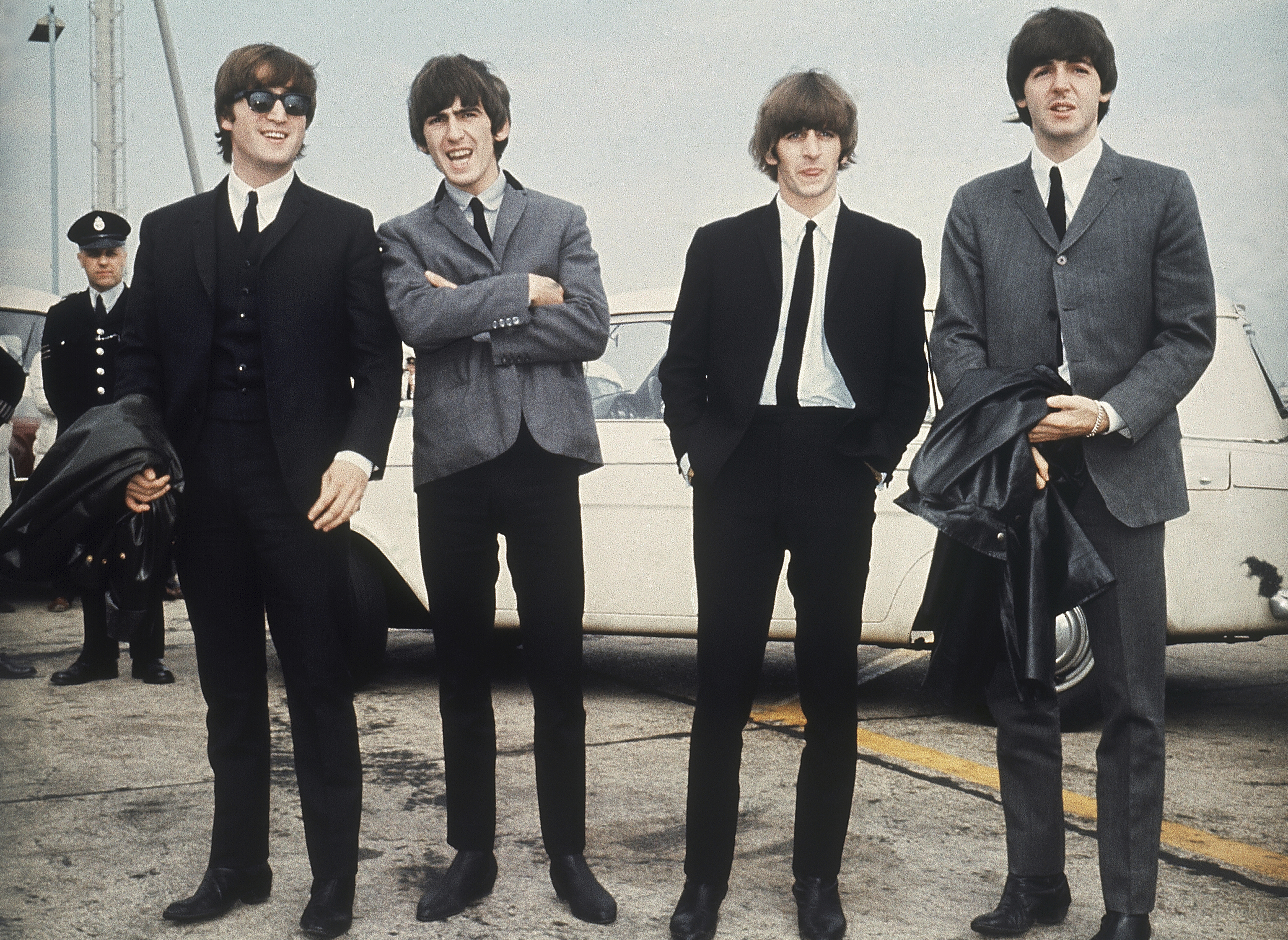 FILE - The Beatles, from left, John Lennon, George Harrison, Ringo Starr and Paul McCartney arrive in Liverpool, England, July 10, 1964. (AP Photo, File)