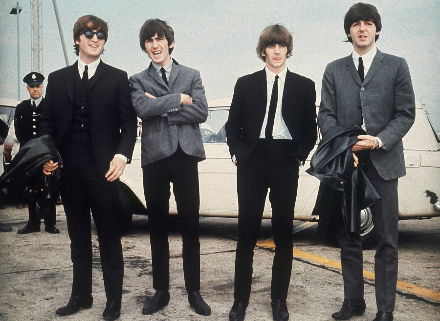 FILE - The Beatles, from left, John Lennon, George Harrison, Ringo Starr and Paul McCartney arrive in Liverpool, England, July 10, 1964. (AP Photo, File)