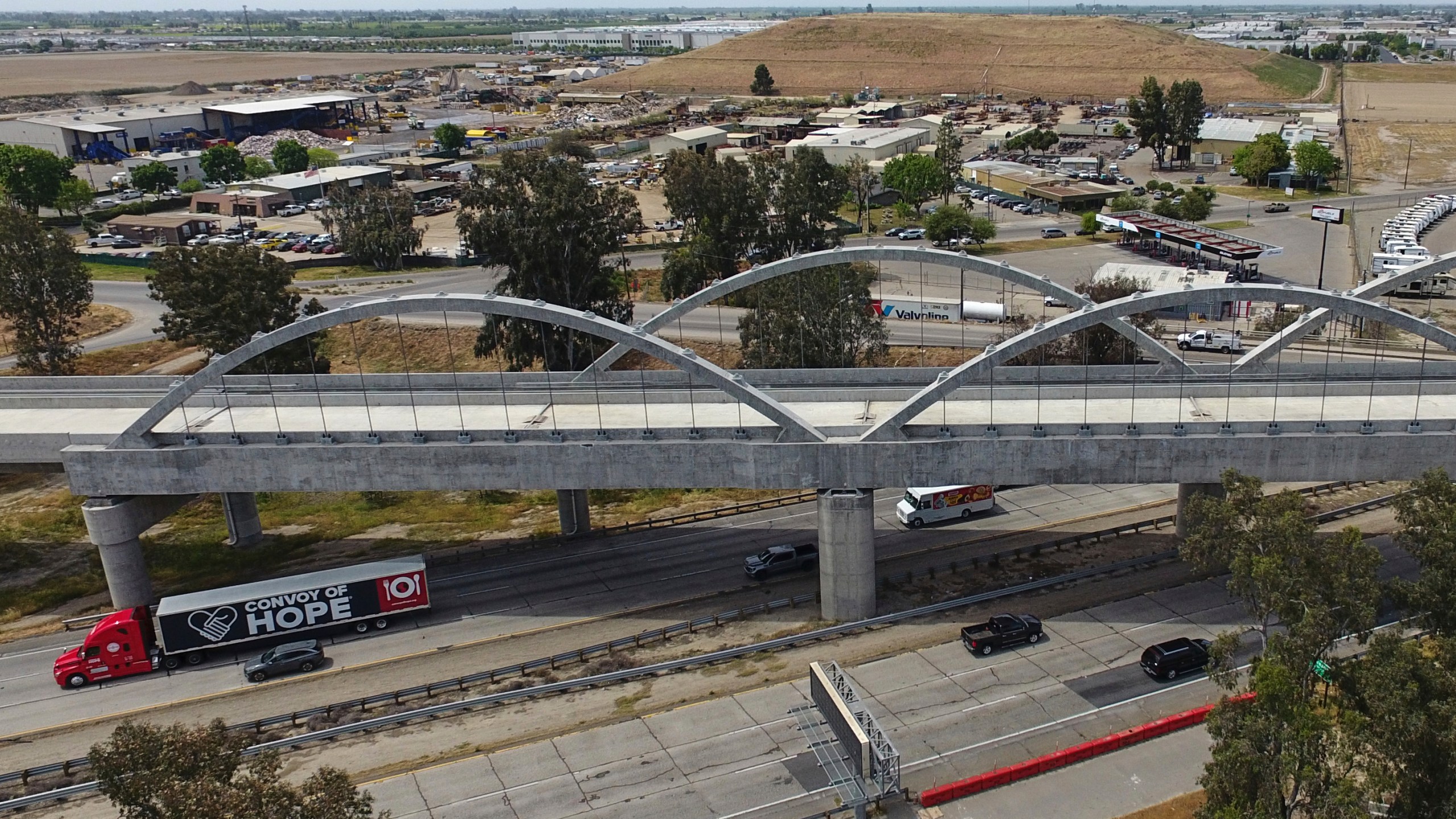 FILE - Vehicles pass underneath the Cedar Viaduct, designed to take high-speed trains over Cedar and North avenues and State Route 99, on April 15, 2025, in Fresno, Calif. (AP Photo/Godofredo A. Vásquez, File)
