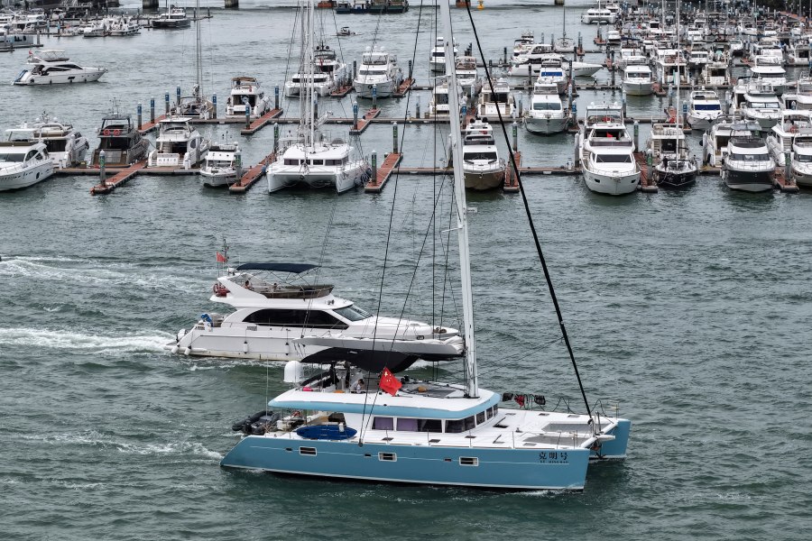 In this Aug. 23, 2025, aerial photo released by Xinhua News Agency, yachts return to dock ahead of Typhoon Kajiki in Sanya, southern China's Hainan Province. (Zhao Yingquan/Xinhua via AP)