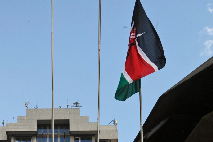 FILE - The Kenyan flag flies at the Kenyatta International Conference Centre during Kenya President Mwai Kibaki's speech inside the building in Nairobi, Kenya, Aug. 5, 2010. (AP Photo/Sayyid Azim, File)