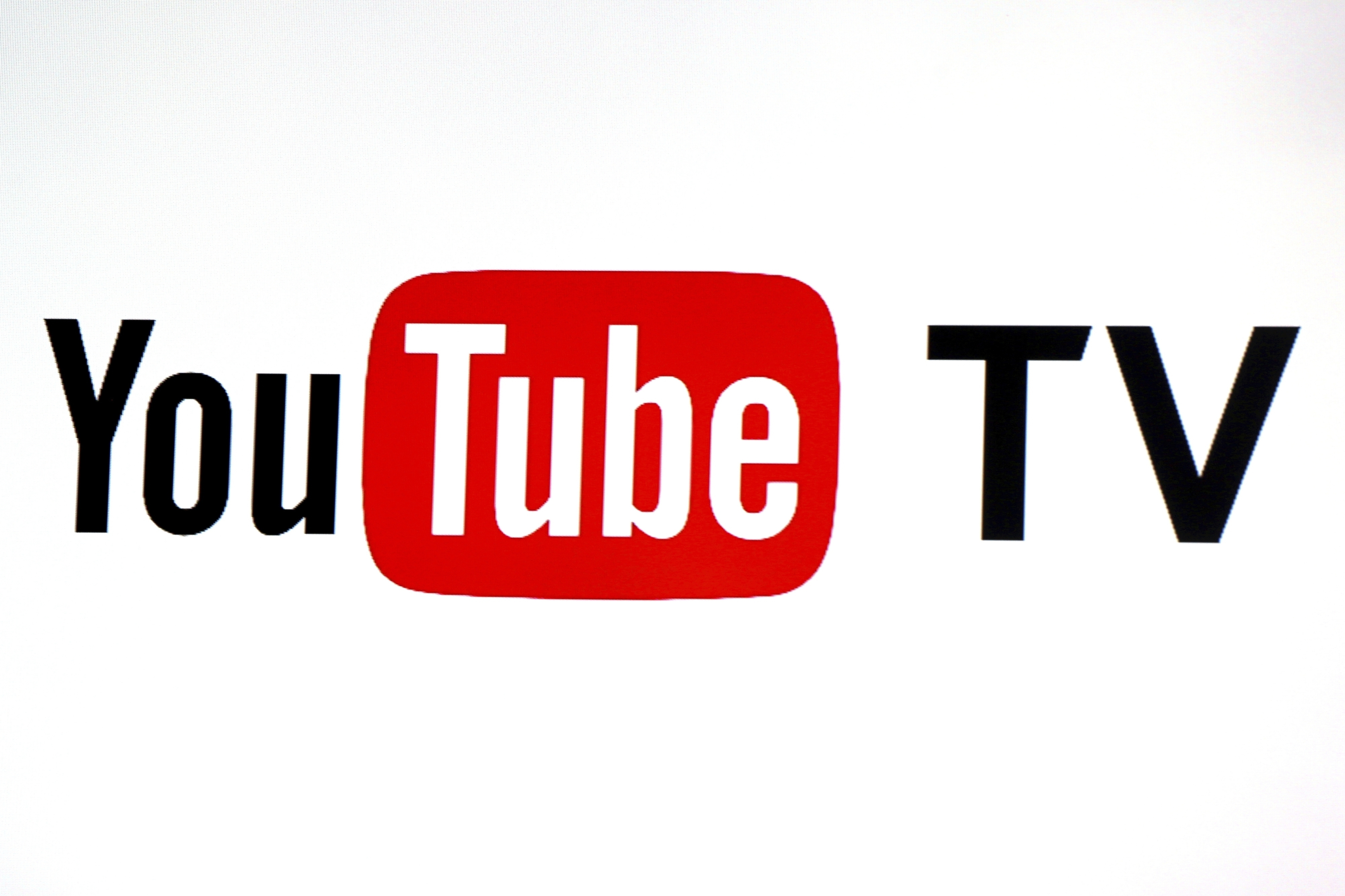FILE - YouTube TV logo is seen at the YouTube Space LA in Los Angeles, Feb. 28, 2017. (AP Photo/Reed Saxon, File)