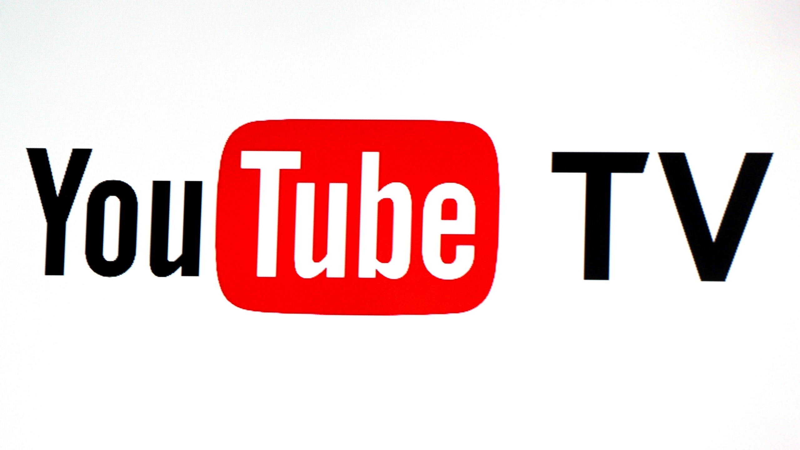 FILE - YouTube TV logo is seen at the YouTube Space LA in Los Angeles, Feb. 28, 2017. (AP Photo/Reed Saxon, File)