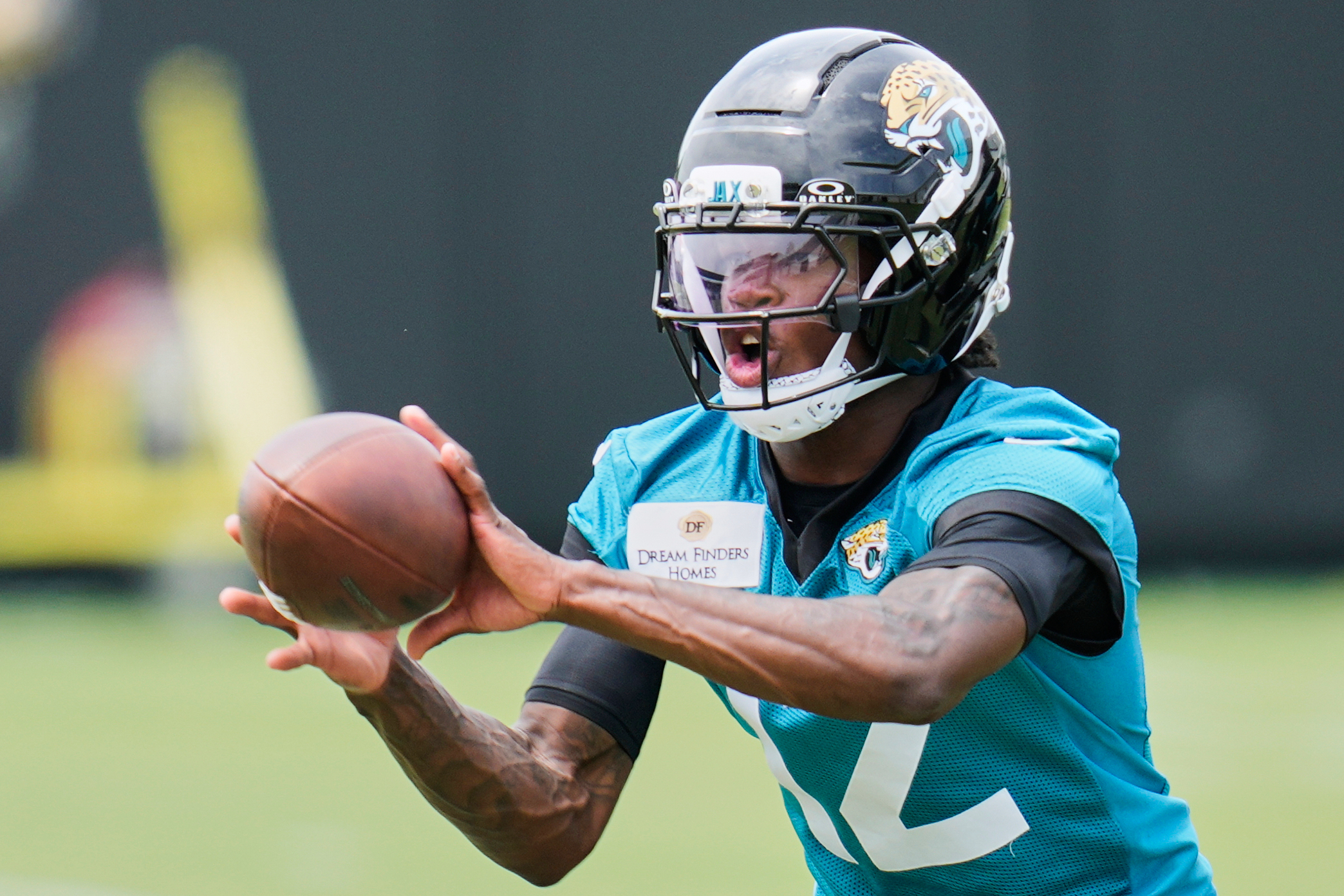 FILE - Jacksonville Jaguars wide receiver Travis Hunter makes a reception during the NFL football team's rookie minicamp, Saturday, May 10, 2025, in Jacksonville, Fla. (AP Photo/John Raoux, File)