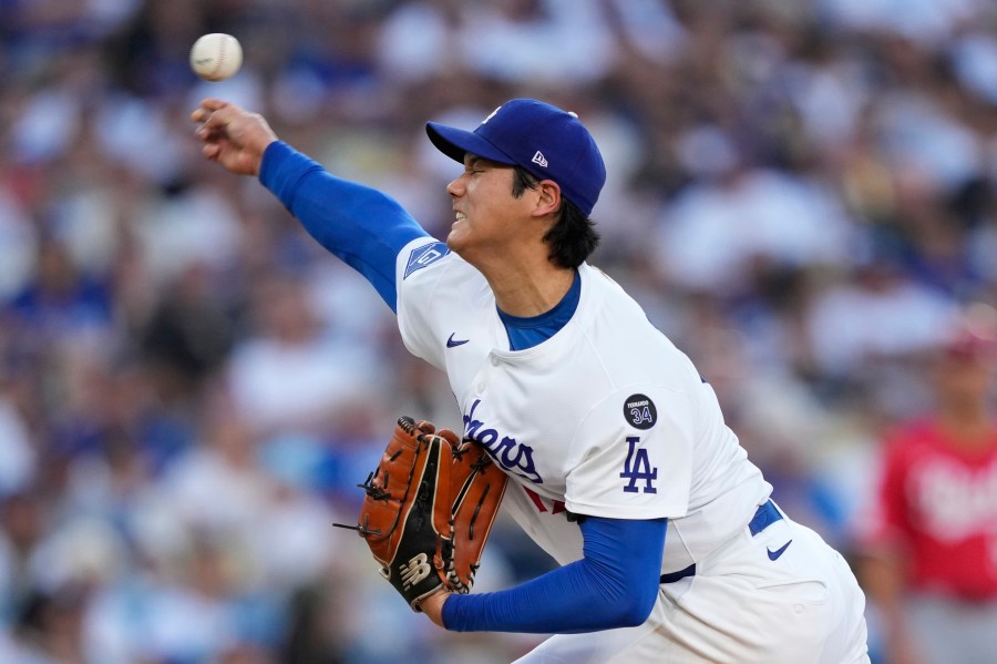 Los Angeles Dodgers starting pitcher Shohei Ohtani works against a Cincinnati Reds batter during the fourth inning of a baseball game Wednesday, Aug. 27, 2025, in Los Angeles. (AP Photo/Mark J. Terrill)