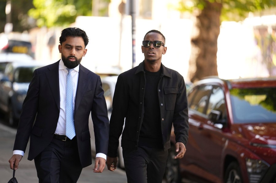 Top Boy actor Micheal Ward, right, arrives at Thames Magistrates' Court, where he is charged with rape and sexual assault, in London, Thursday, Aug. 28, 2025. (Jordan Pettitt/PA via AP)