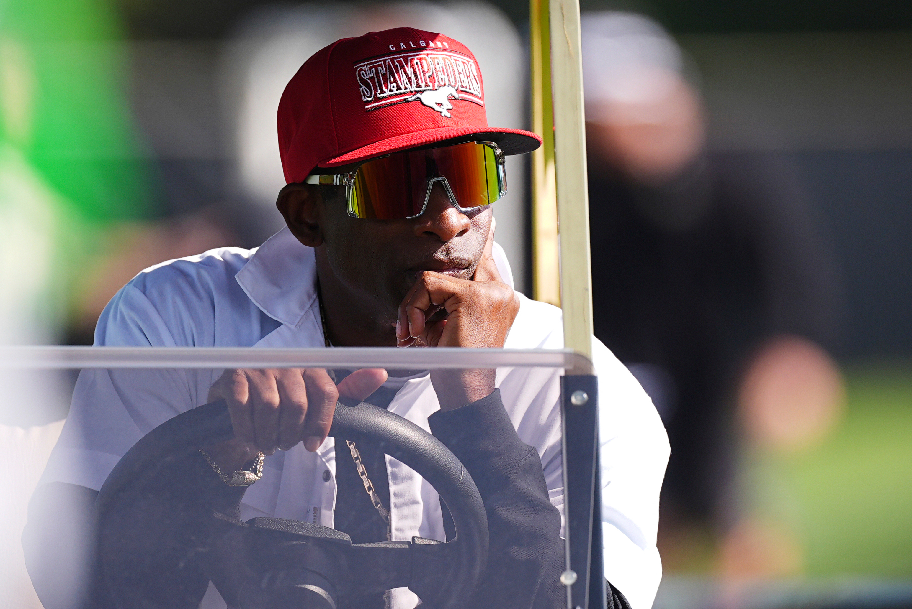 Colorado head coach Deion Sanders looks on from a golf cart as players take part in drills during NCAA college football practice, Thursday, Aug. 14, 2025, in Boulder, Colo.(AP Photo/David Zalubowski)