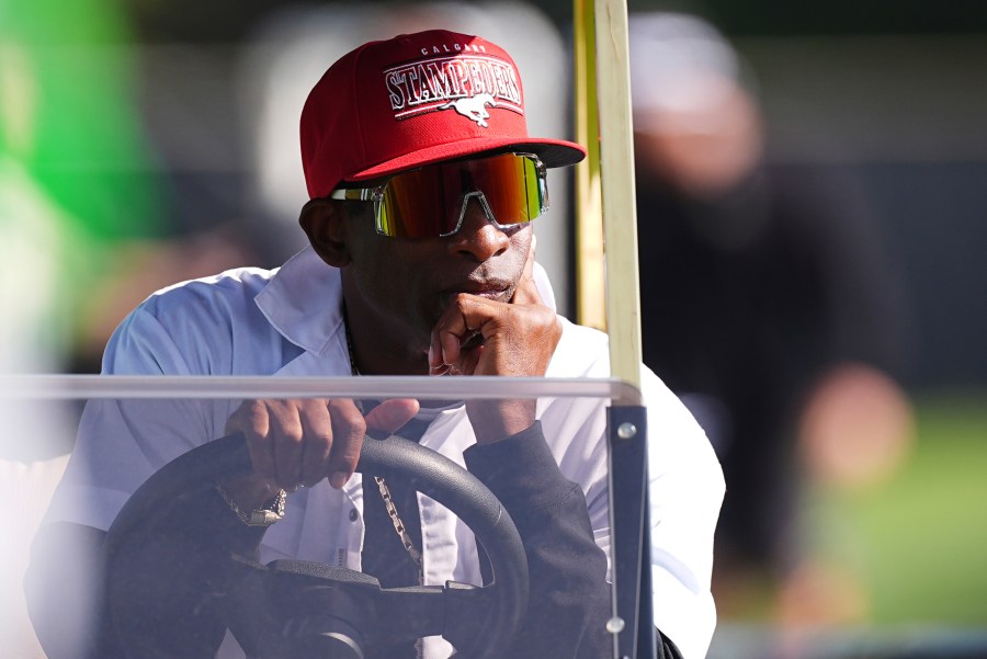 Colorado head coach Deion Sanders looks on from a golf cart as players take part in drills during NCAA college football practice, Thursday, Aug. 14, 2025, in Boulder, Colo.(AP Photo/David Zalubowski)