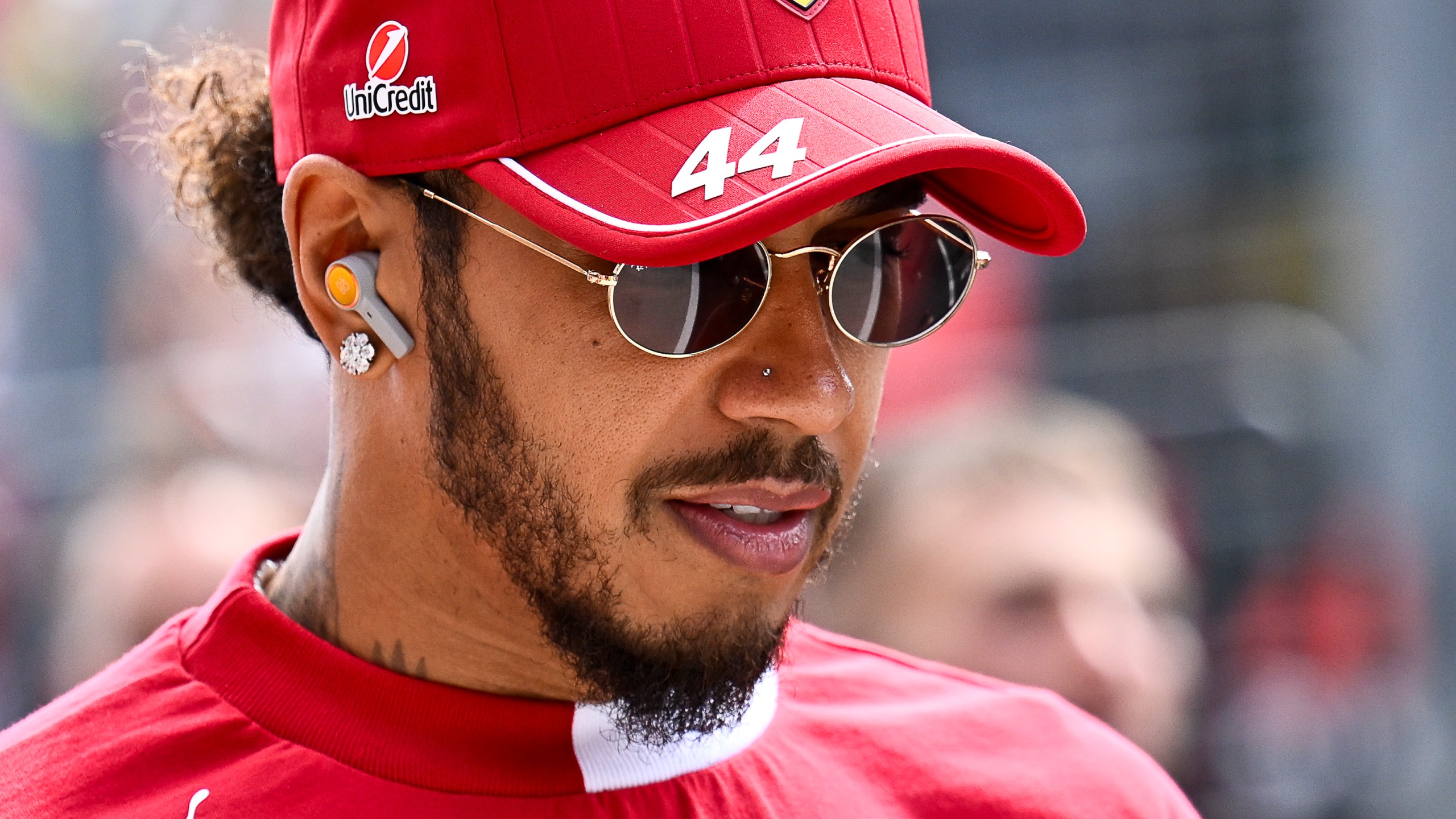 Ferrari driver Lewis Hamilton of the United Kingdom arrives to the drivers parade at the Hungaroring racetrack, in Mogyorod, Hungary, Sunday, Aug. 3, 2025, ahead of the Hungarian Formula One Grand Prix. (AP Photo/Denes Erdos)