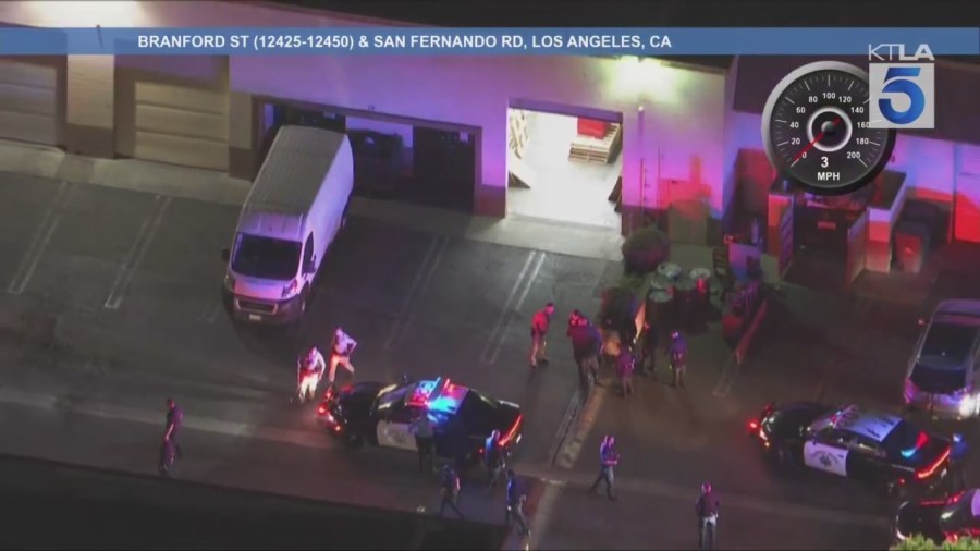 The male suspect ditched the stolen SUV in Pacoima and ran into a warehouse-type building where he barricaded himself on Aug. 12, 2025. (KTLA)