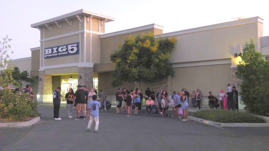 Loved ones formed a search party outisde the Big 5 Sporting Goods store in Yucaipa to locate 7-month-old Emmanuel Haro on Aug. 15, 2025. (KTLA)