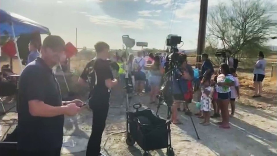 Community members and media gathered outside Jake and Rebecca Haro's home in Cabazon following their arrest for murder on Aug. 22, 2025. (KTLA)