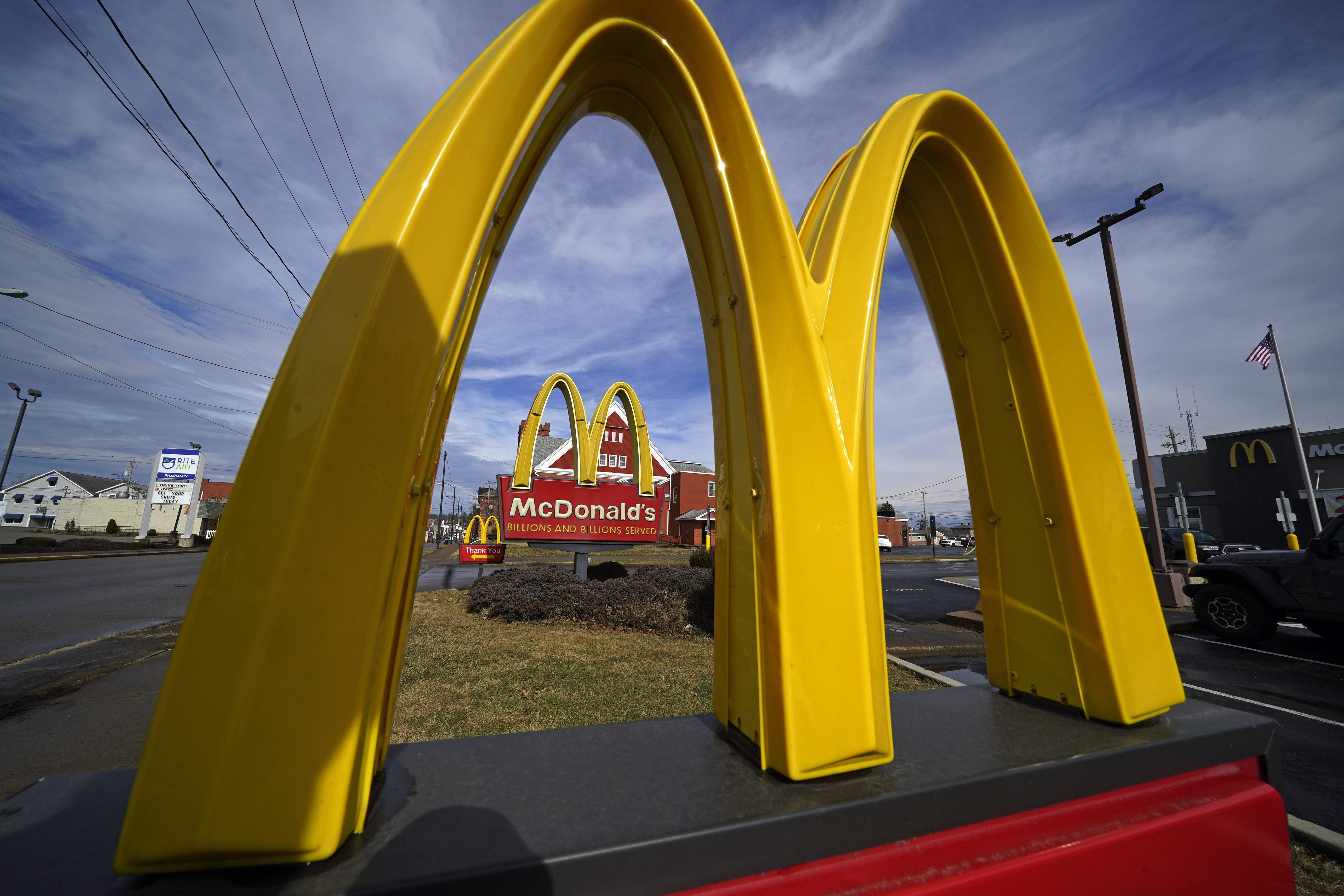 FILE - McDonald's restaurant signs are shown in in East Palestine, Ohio, Feb. 9, 2023. (AP Photo/Gene J. Puskar, File)