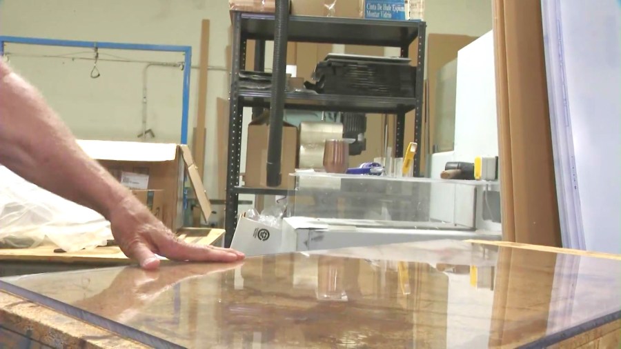 Ray Tissan's polycarbonate unbreakable glass product is helping deter burglars and theives by protecting customer's merchandise and stores. (KTLA)