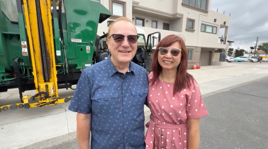 Paul Bukauskas and his wife pose together next to a garbage truck that he tracked down after accidentally throwing out his wedding ring. Sept. 2026. (KTLA)