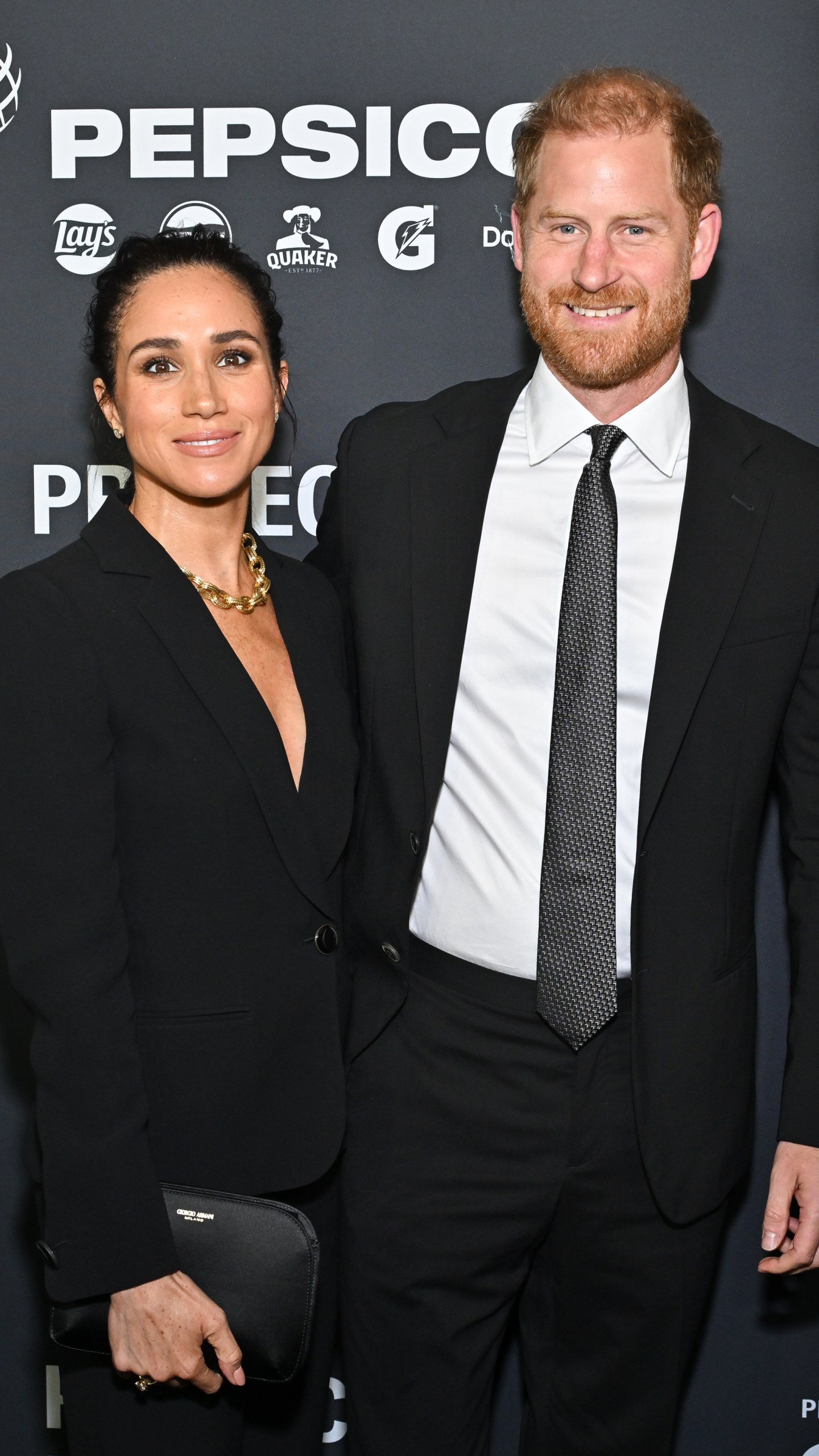 Meghan Markle, left, and Prince Harry, The Duke and Duchess of Sussex, attend the third annual World Mental Health Day Gala, hosted by Project Healthy Minds, at Spring Studios on Thursday, Oct. 9, 2025, in New York. (Photo by Evan Agostini/Invision/AP)