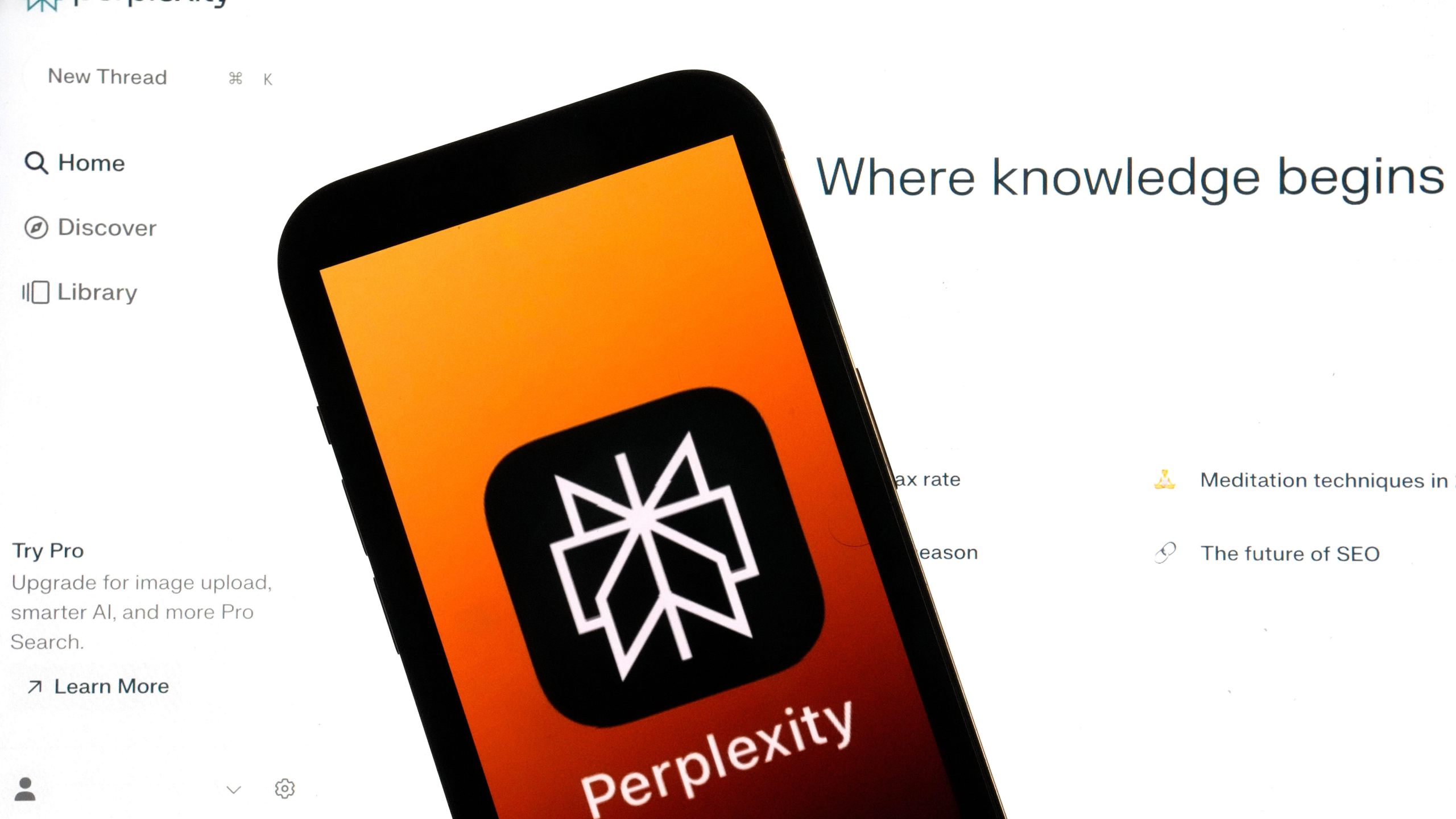 FILE - The Perplexity website and logo are shown in this photo, in New York, Friday, July 5, 2024. (AP Photo/Richard Drew, File)