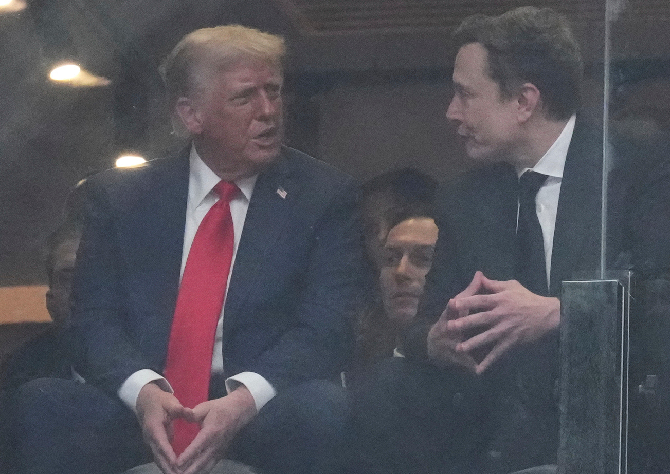 FILE - President Donald Trump, left, and Elon Musk talk during a memorial for Charlie Kirk, Sunday, Sept. 21, 2025, at State Farm Stadium in Glendale, Ariz. (AP Photo/Ross D. Franklin, File)