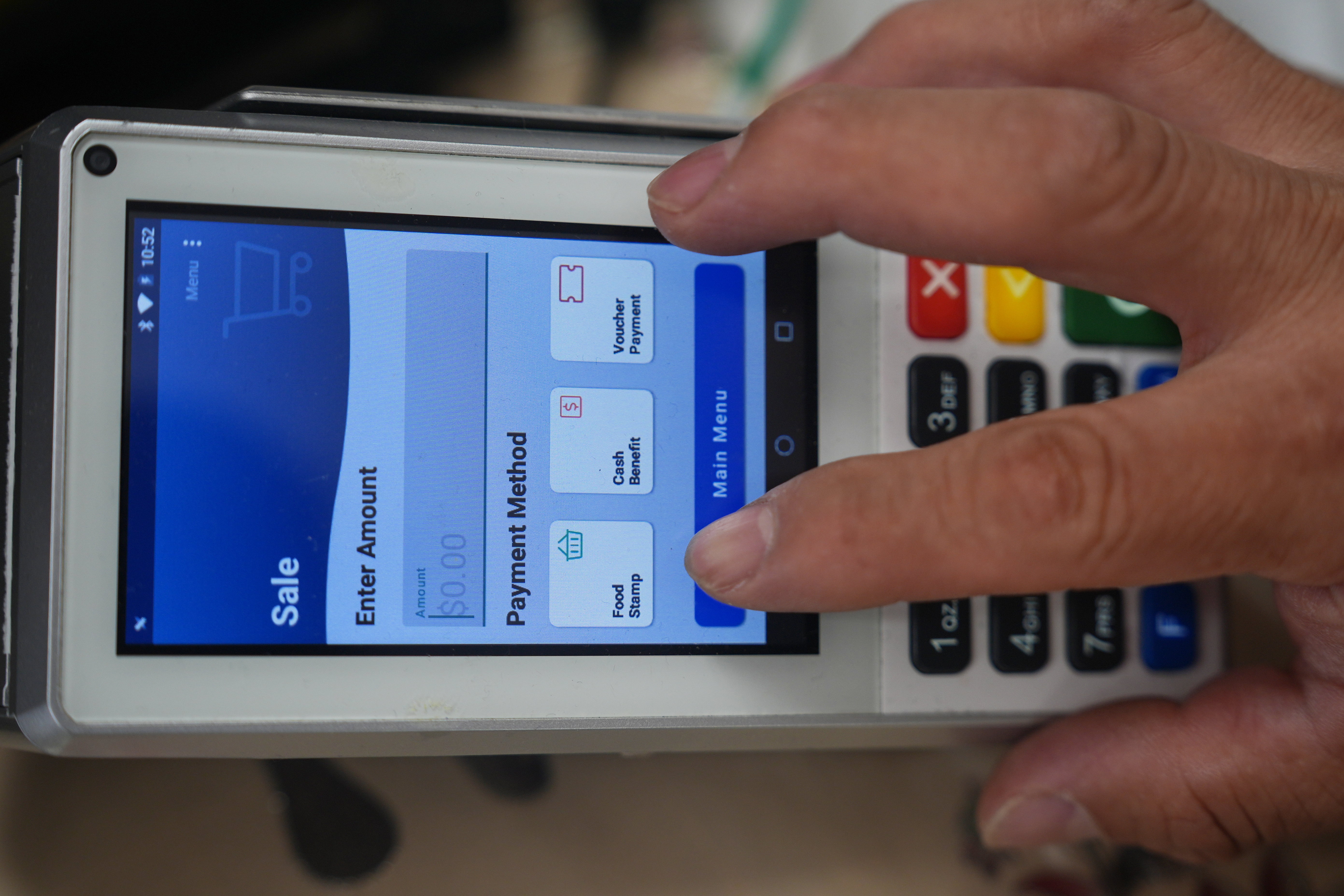 A shopper makes a purchase with food stamps on Monday, Oct. 27, 2025, in Los Angeles. (AP Photo/Damian Dovarganes)