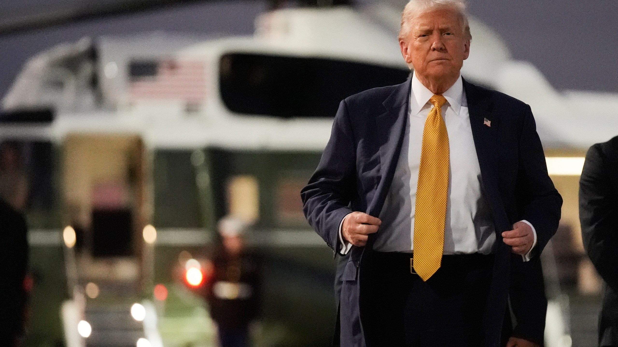 President Donald Trump arrives at Haneda Airport before switching his ride to Marine One in Tokyo, Japan, Monday, Oct. 27, 2025, following his visit at the ASEAN summit in Malaysia. (AP Photo/Mark Schiefelbein)