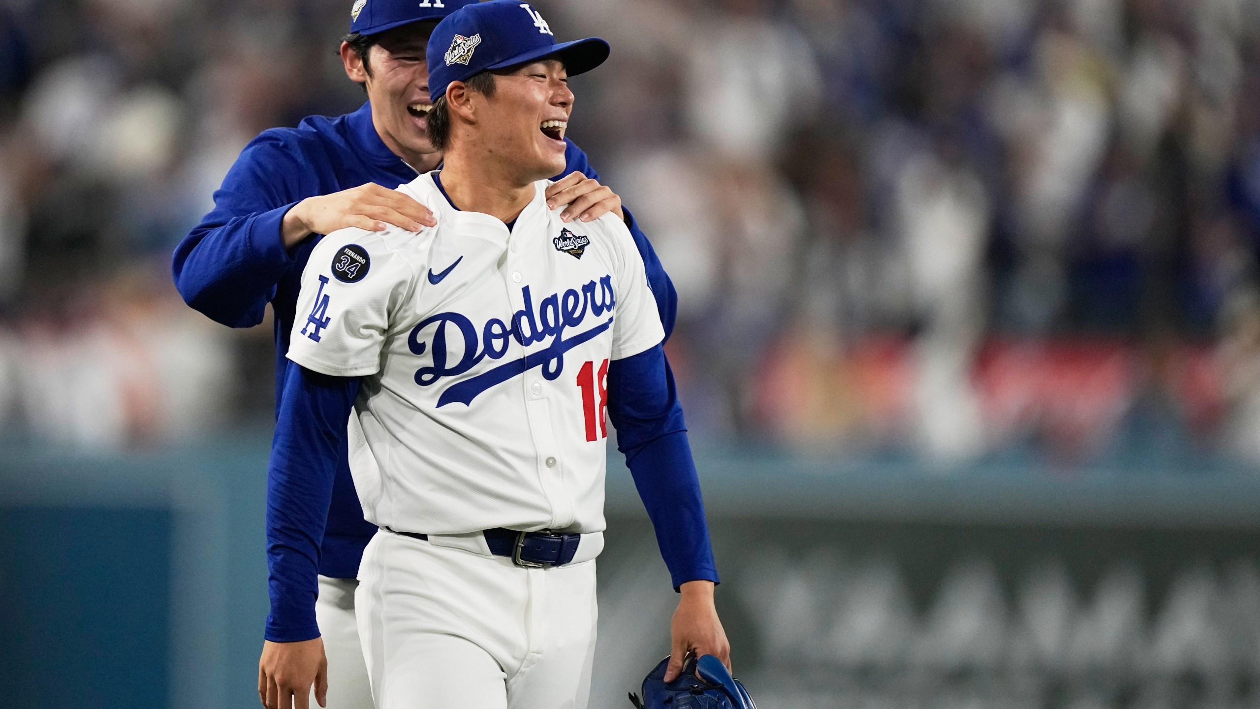 Los Angeles Dodgers pitcher Yoshinobu Yamamoto celebrates their win against the Toronto Blue Jays during the 18th inning in Game 3 of baseball's World Series, Monday, Oct. 27, 2025, in Los Angeles. (AP Photo/Brynn Anderson)