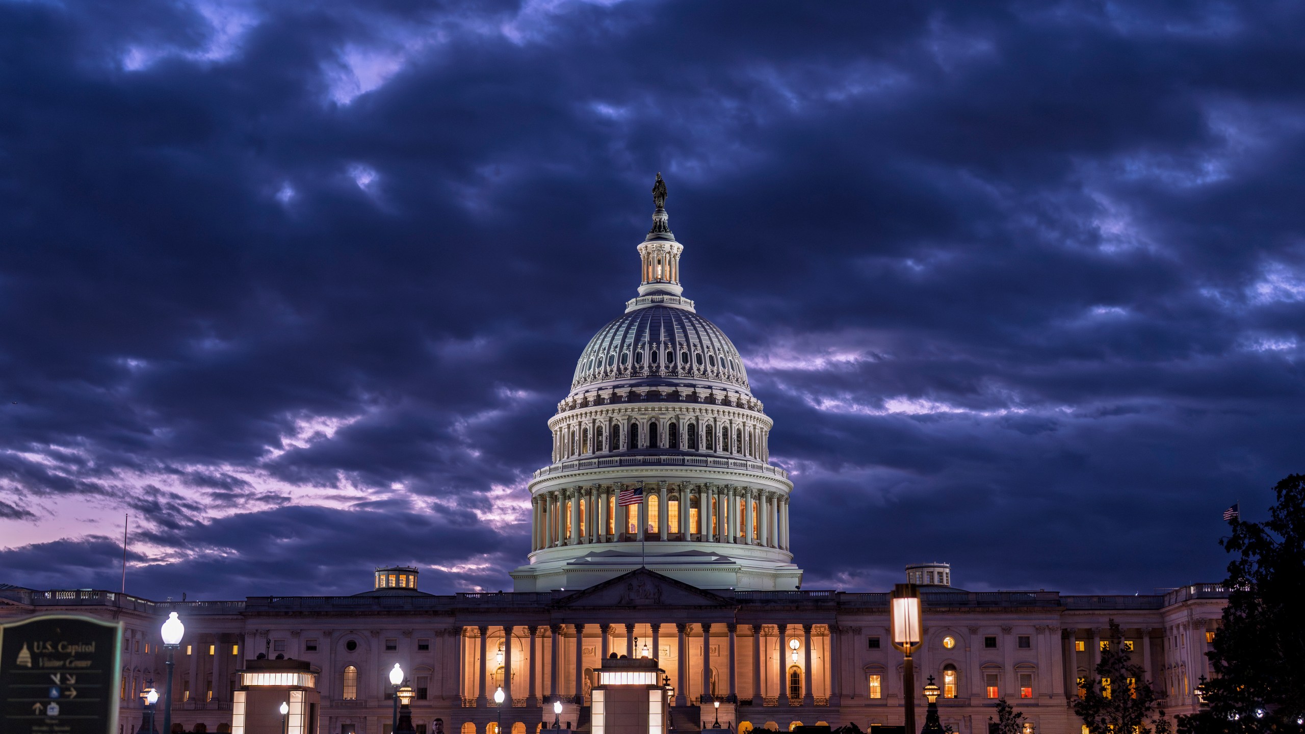FILE - The Capitol is seen at nightfall on day 22 of a government shutdown in Washington, Oct. 22, 2025. (AP Photo/J. Scott Applewhite, File)