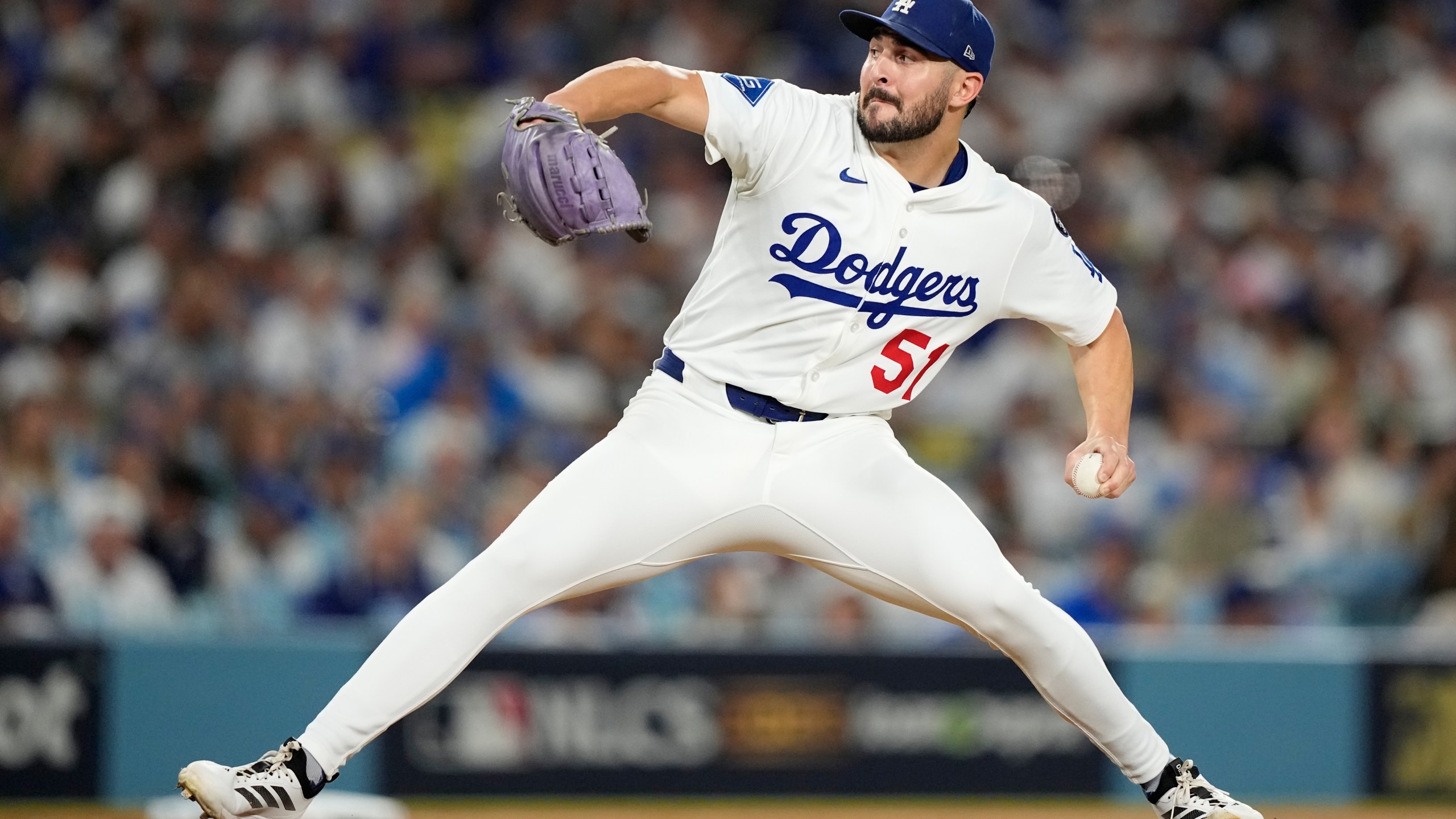 Los Angeles Dodgers pitcher Alex Vesia throws against the Milwaukee Brewers during the seventh inning in Game 4 of baseball's National League Championship Series, Friday, Oct. 17, 2025, in Los Angeles. (AP Photo/Brynn Anderson)