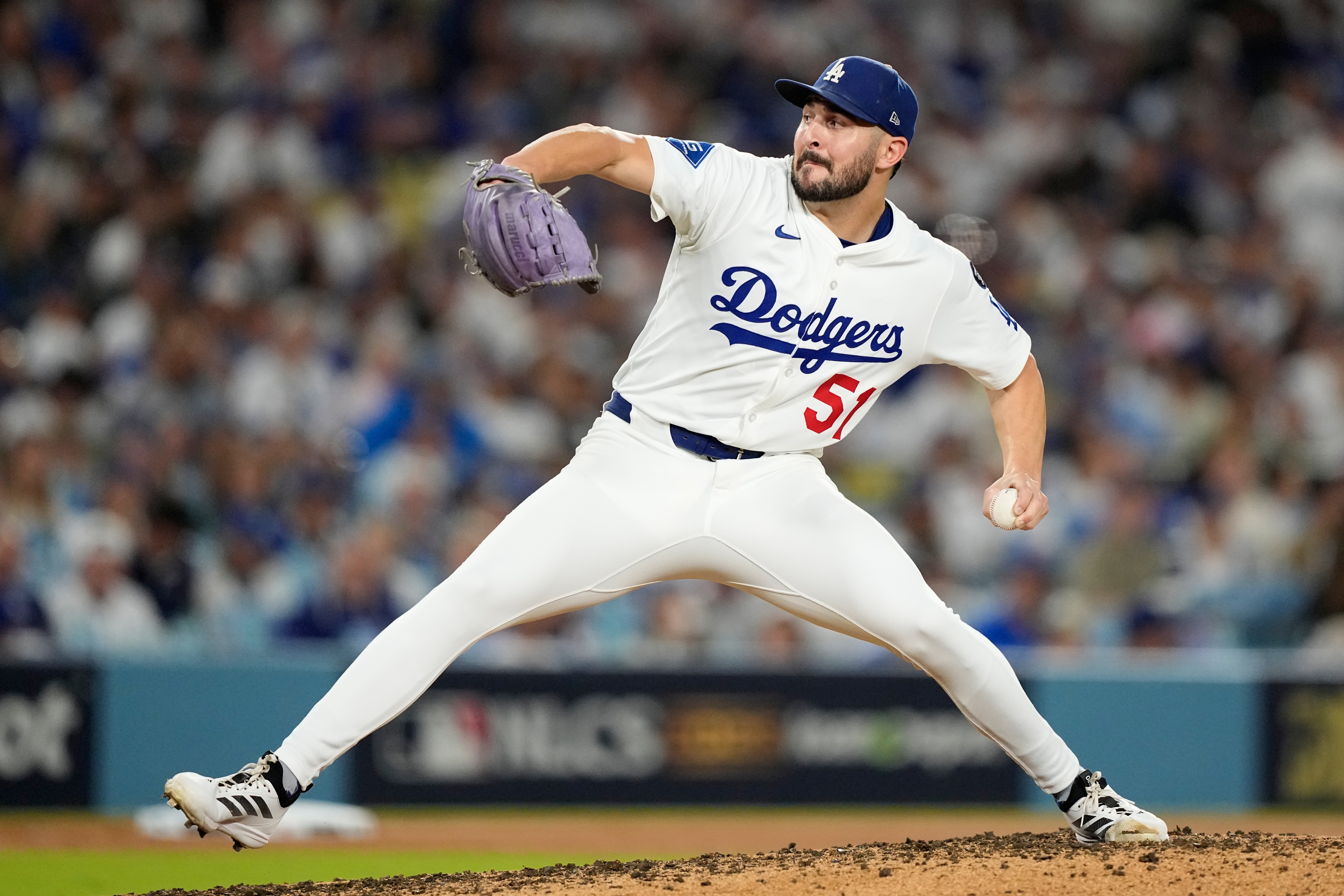 Los Angeles Dodgers pitcher Alex Vesia throws against the Milwaukee Brewers during the seventh inning in Game 4 of baseball's National League Championship Series, Friday, Oct. 17, 2025, in Los Angeles. (AP Photo/Brynn Anderson)