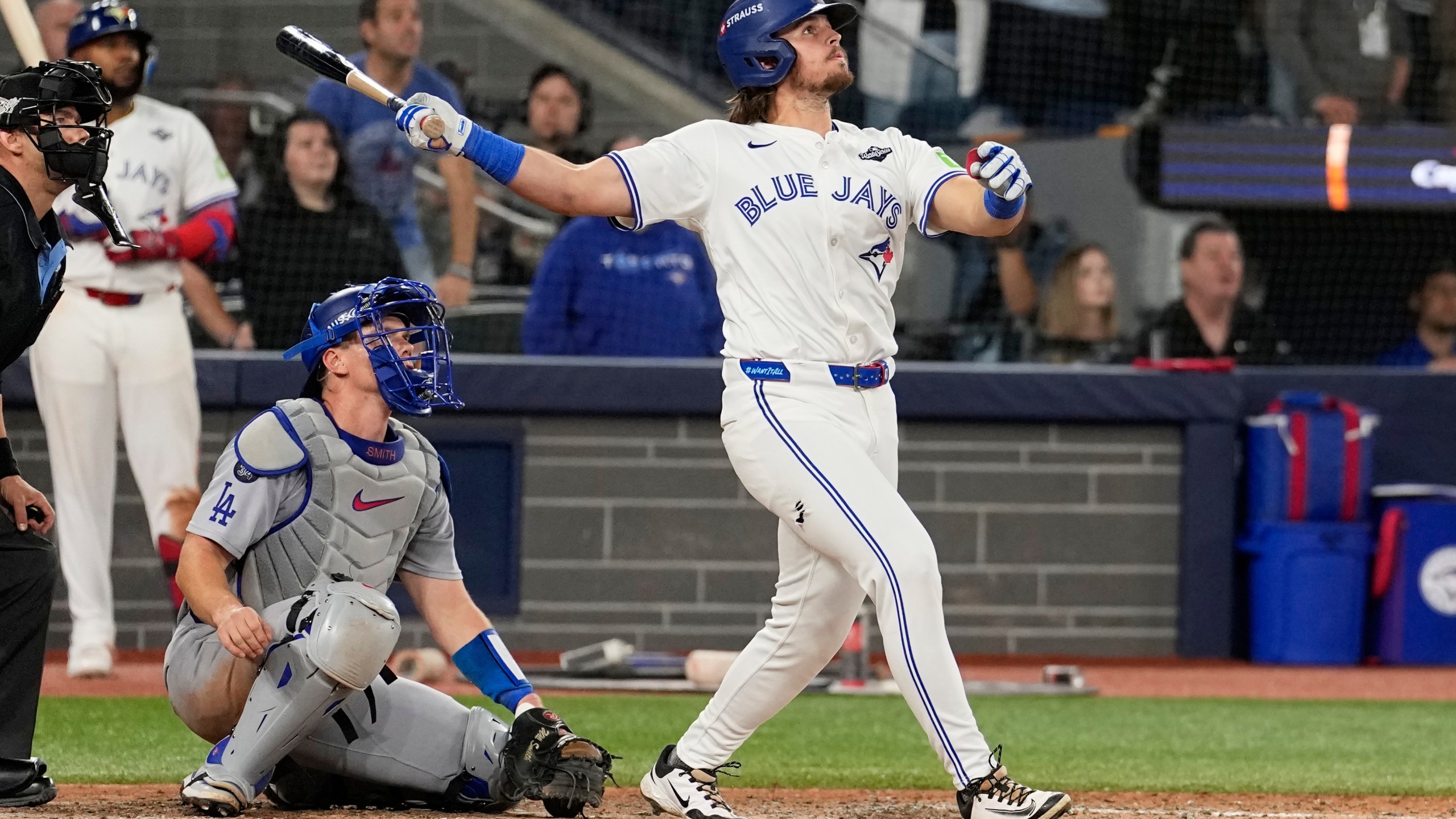 Toronto Blue Jays' Addison Barger watches his grand slam home run against the Los Angeles Dodgers during the sixth inning in Game 1 of baseball's World Series, Friday, Oct. 24, 2025, in Toronto. (AP Photo/David J. Phillip)