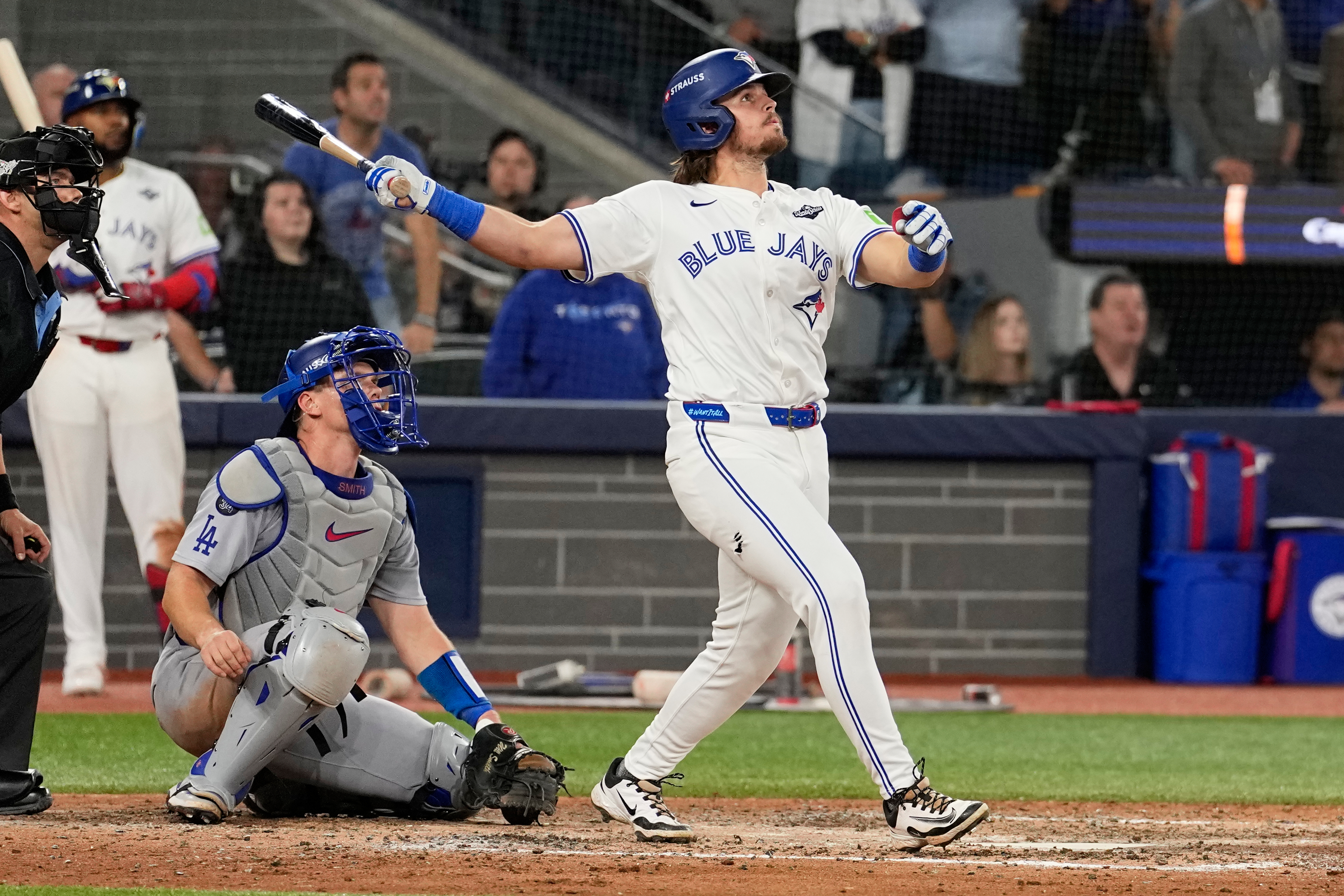 Toronto Blue Jays' Addison Barger watches his grand slam home run against the Los Angeles Dodgers during the sixth inning in Game 1 of baseball's World Series, Friday, Oct. 24, 2025, in Toronto. (AP Photo/David J. Phillip)