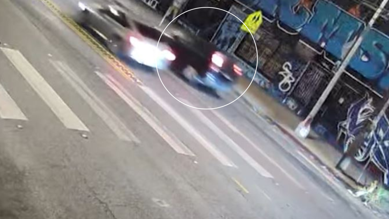 The second suspect's vehicle is a blue compact SUV, possibly a 2007-2011 Honda CR-V. (Los Angeles Police Department)