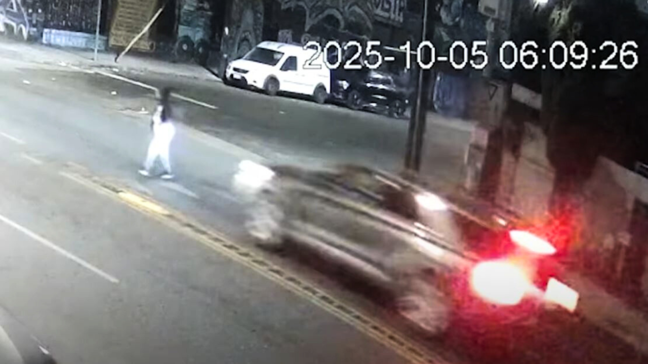 Surveillance cameras captured the victim crossing the street in downtown L.A. moments before she was struck by two hit-and-run drivers on Oct. 5, 2025. (Los Angeles Police Department)