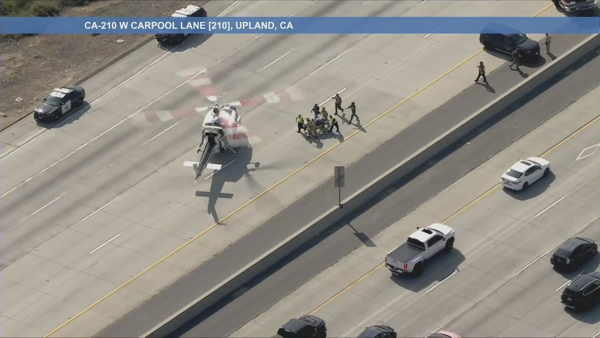 A fleeing motorcyclist who crashed during a pursuit is loaded into an awaiting medical helicopter on the 210 Freeway near Claremont on Oct. 27, 2025. (KTLA)