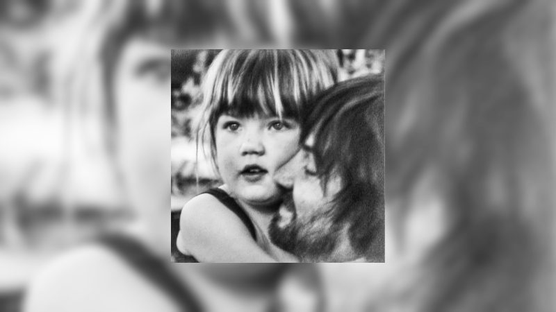 Cover of Tame Impala's fifth album "Deadbeat," which features a black and white photo of Parker holding a child, presumably his